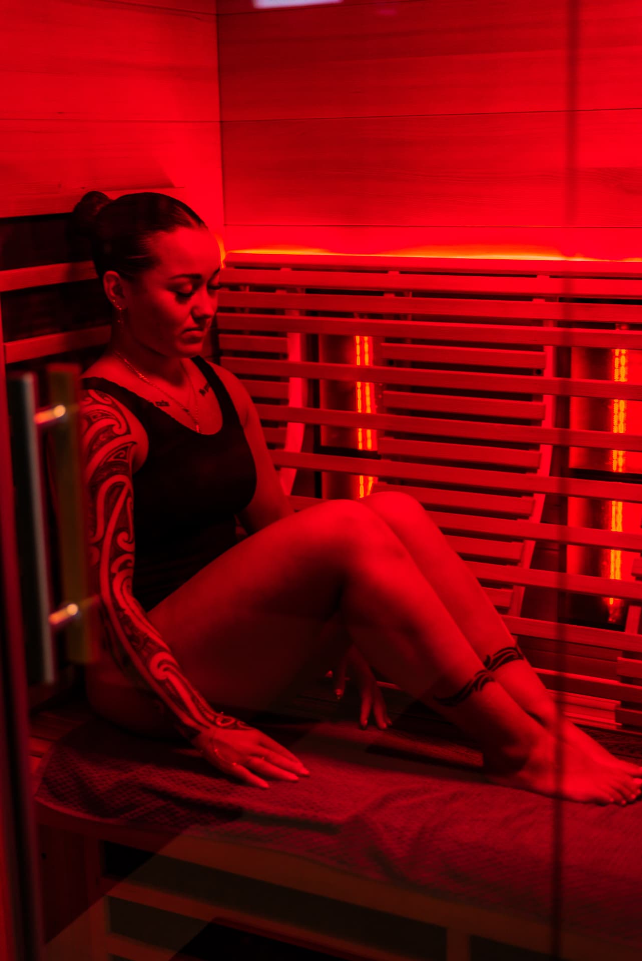 Woman relaxing in the private infrared sauna in Lower Hutt