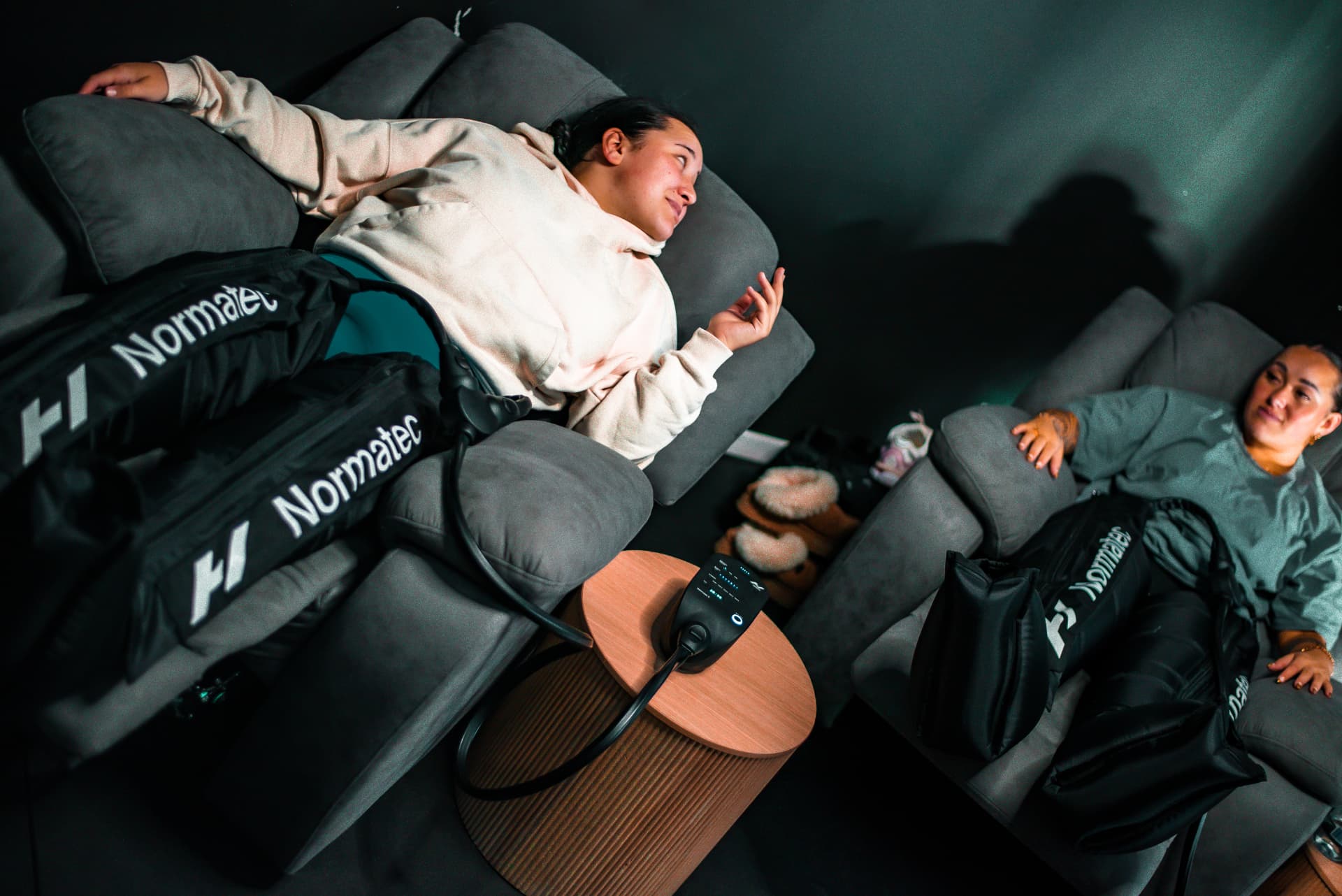 Compression therapy boots on recliners at Recovery Hub Lower Hutt